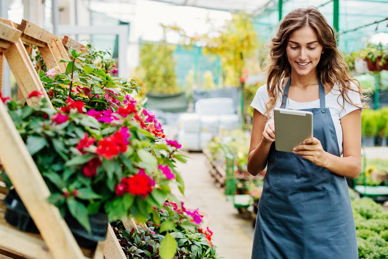 florist holding a tablet