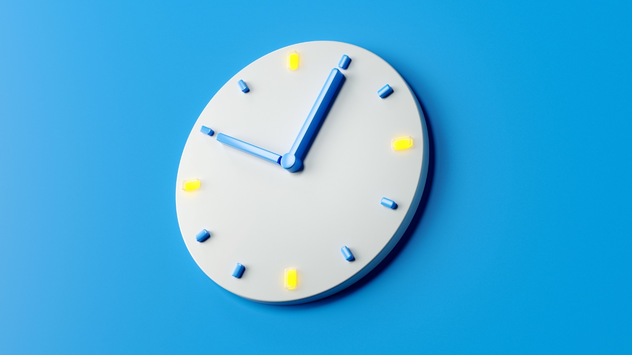 Time clock analog white on pastel blue background