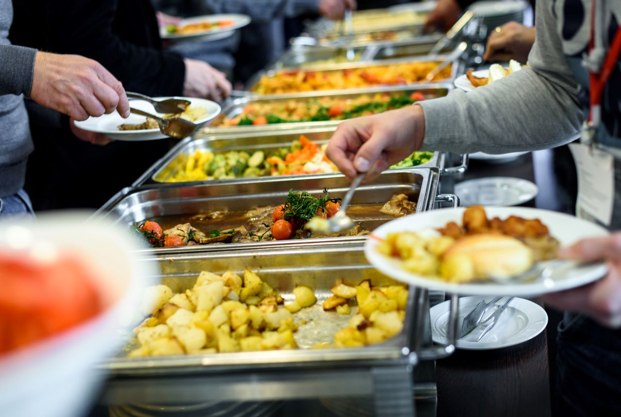 Group of people in all you can eat catering buffet