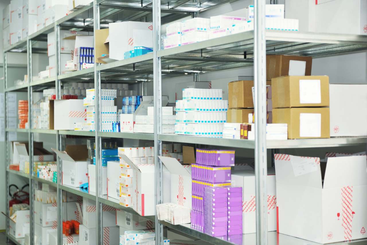 different types of medicine stacked on a shelf inside a cold storage unit