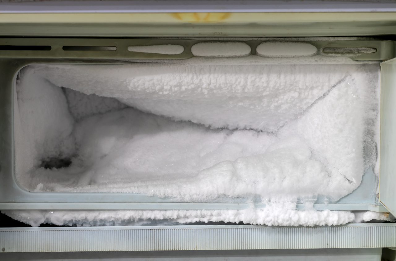 frost buildup inside an old refrigerator's freezer